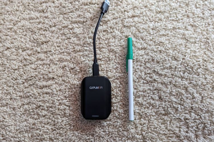 CARLIMKI Wireless Car Adapter and ball point pen side by side.